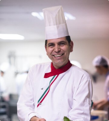 Professional chef in white uniform